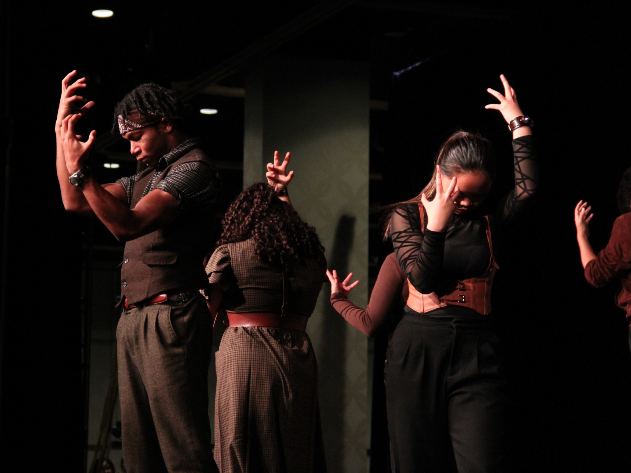 Show choir students posing during a performance