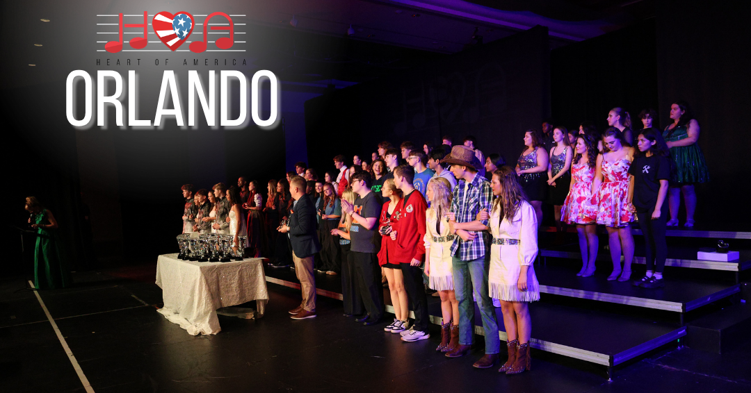 performers standing on stage for awards