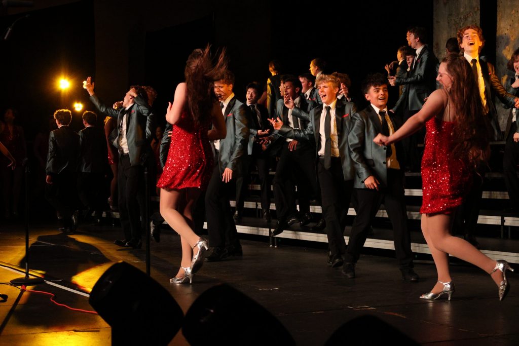 Synergy from Johnston High School performing on stage