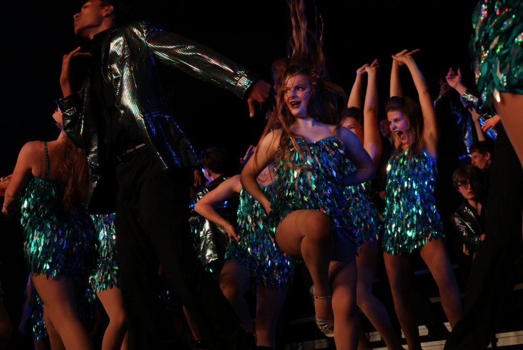 Synergy from Johnston High School performing on stage