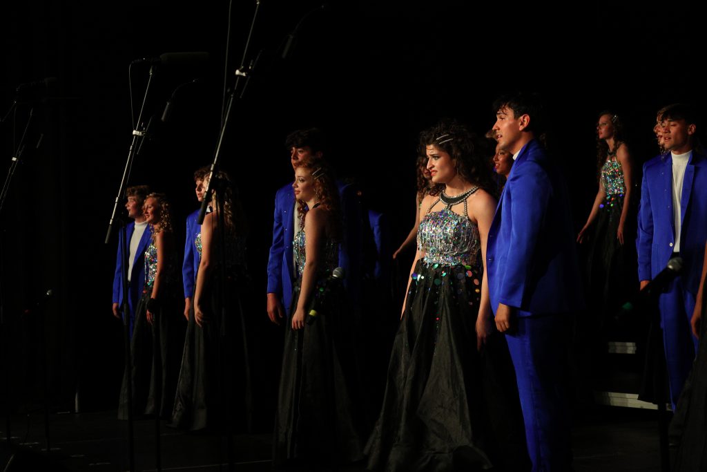 The Amazing Technicolor Show Choir from Omaha Westside High School performing on stage