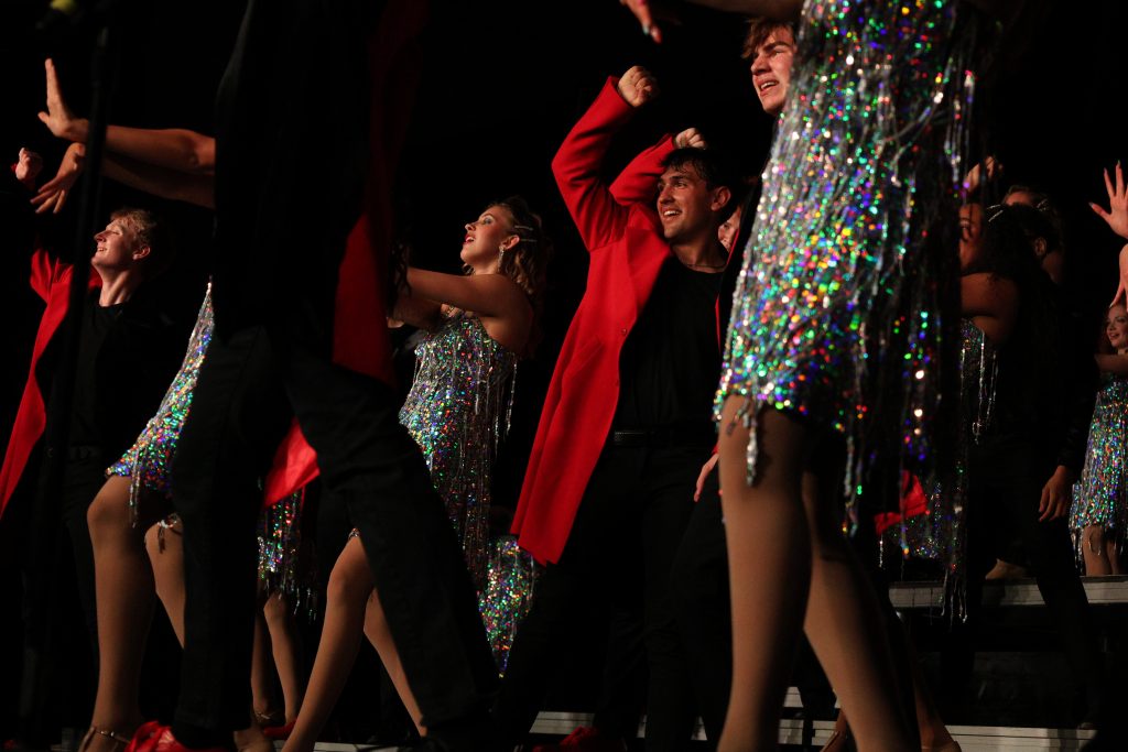 The Amazing Technicolor Show Choir from Omaha Westside High School performing on stage