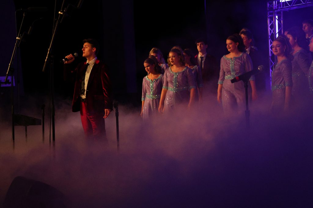 Varsity Singers from Huntington North High School performing on stage