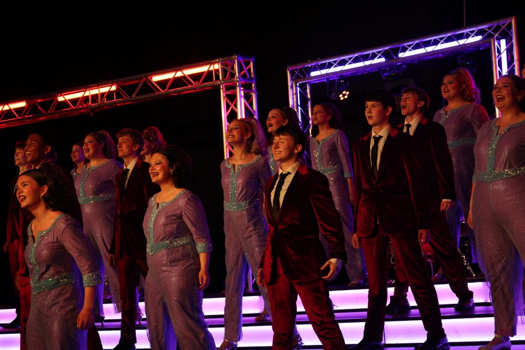 Varsity Singers from Huntington North High School performing on stage