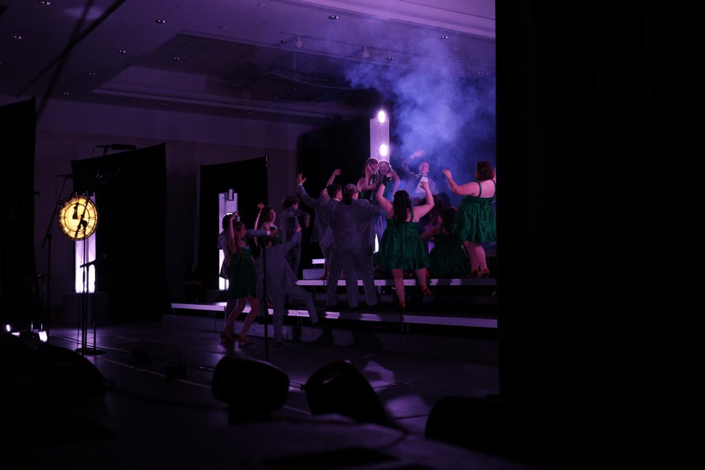 Syndicated Sound from Tarpon Springs High School performing in green dresses