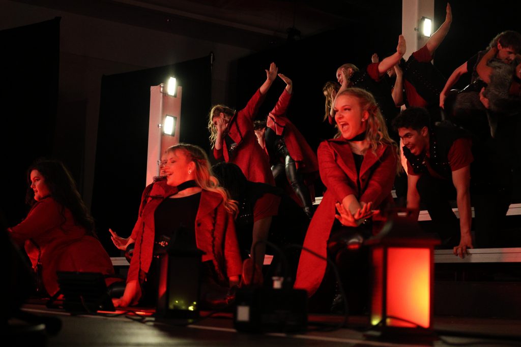 Syndicated Sound from Tarpon Springs High School performing in red jackets